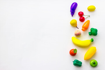 Concept of food and diet. Mini toy organic fruits and vegetables. Organic market concept.