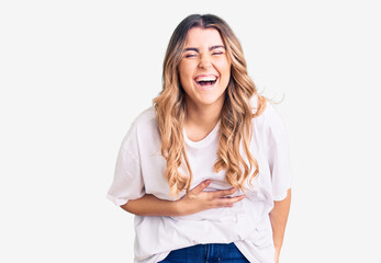 Young caucasian woman wearing casual clothes smiling and laughing hard out loud because funny crazy...