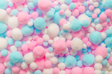Fototapeta na wymiar White, pink and blue soft pompons