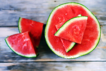 Melon and watermelon slices on a wooden surface. Selective focus. Macro.