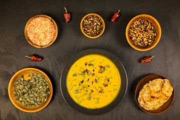 Pumpkin soup with fresh autumn hokkaido pumpkins.  Healthy food. Homemade preparation of pumpkin soup.