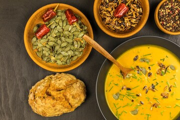 Pumpkin soup with fresh autumn hokkaido pumpkins.  Healthy food. Homemade preparation of pumpkin soup.