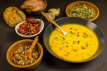 Pumpkin soup with fresh autumn hokkaido pumpkins.  Healthy food. Homemade preparation of pumpkin soup.