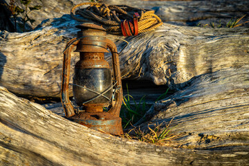 Vintage Railroad lantern lit up from the sunset