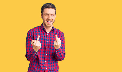 Handsome young man with bear wearing casual shirt showing middle finger doing fuck you bad...