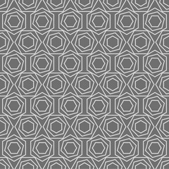 Seamless vector pattern in gray colors. Geometric texture from hexagons for printing on fabric, packaging, wallpaper, covers.