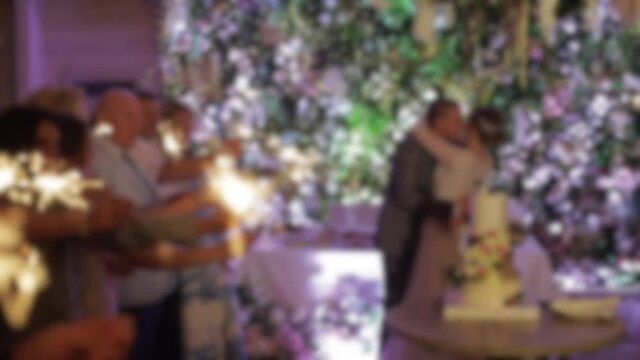 Blurred background newlyweds with wedding cake on holiday
