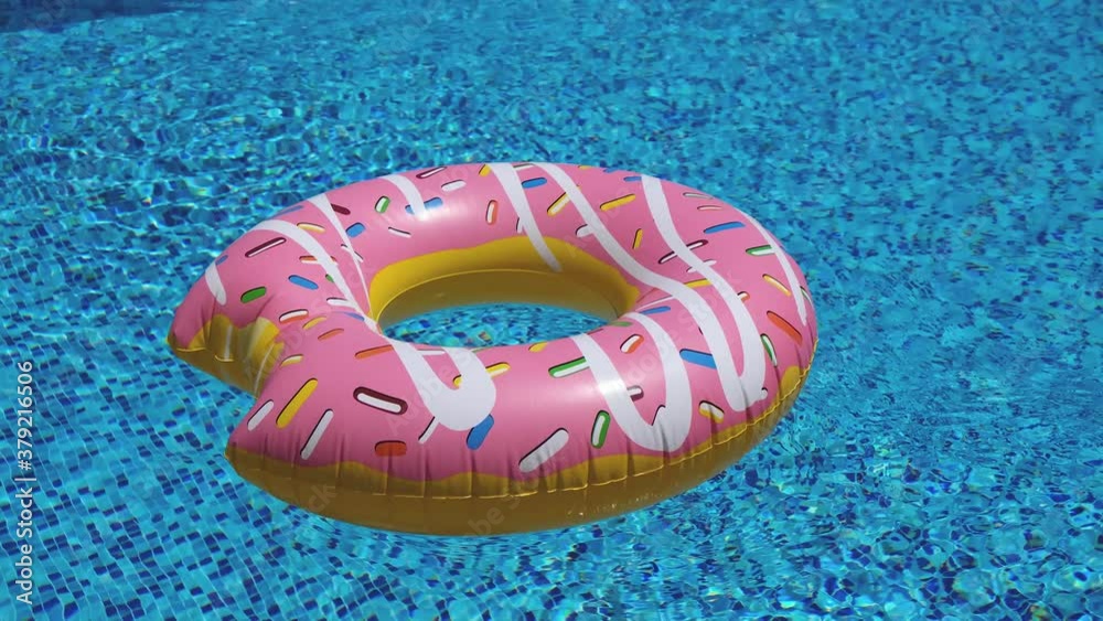Poster pink inflatable donut floating in swimming pool 4k