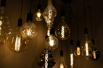 The incandescent lamp is round, oval, creative shape. Set of lighting devices for the home. Background backdrop design