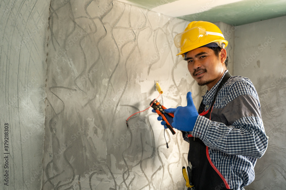 Poster Electrician working with switches and sockets of a residential electrical system.