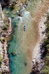 men canoeing in river. Two guys kayaking in mountain river. Aerial view. 