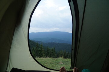 view from the camping tent in the mountains