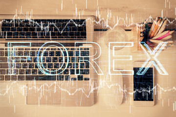 Multi exposure of forex graph drawing over desktop background with computer. Concept of financial analysis. Top view.