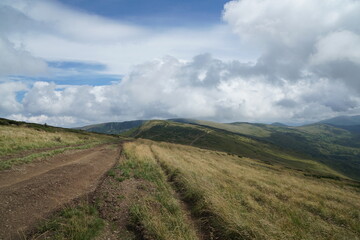 landscape with clouds over the mountain road