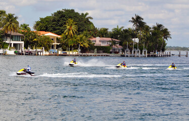 Fototapeta na wymiar Sunday morning jet skiers on Biscayne Bay off of Rivo Alton Island in Miami Beach,Florida.