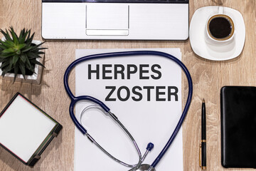 Stethoscope on notebook and pencil with Herpes zoster words as medical concept.