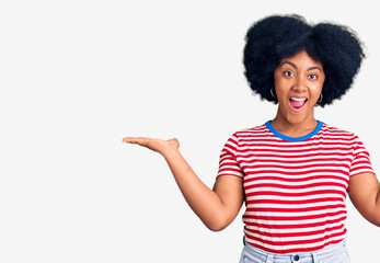 Young african american girl wearing casual clothes celebrating victory with happy smile and winner expression with raised hands