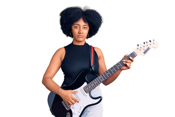 Young african american girl playing electric guitar thinking attitude and sober expression looking self confident