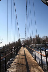 Beautiful Montmorency falls with snow in winter and the typical bridge, Quebec, Canada