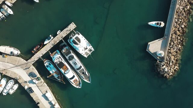 Aerial view of the pier with Paros island on a background Naousa village