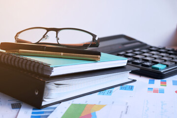 Calculator and pencil. Office equipment at workplace. Conceptual image of desk work, financial paperwork and business economy.