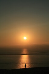 Silhouette on the beach at sunset