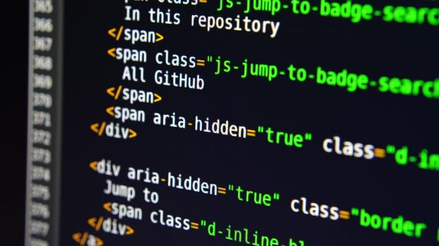 The program text moves on the computer screen. Macro shooting of computer display