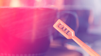 coffee stick engraved with "Cafe" in a coffee shop