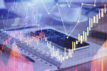 Double exposure of forex chart drawing and cell phone background. Concept of financial data analysis