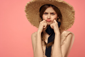 Romantic girl with pigtails and in a straw hat smile romance pink background Copy Space