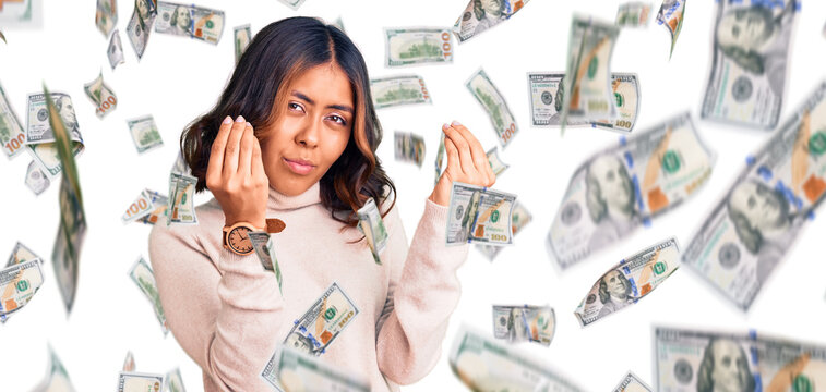 Young beautiful mixed race woman wearing winter turtleneck sweater doing money gesture with hands, asking for salary payment, millionaire business