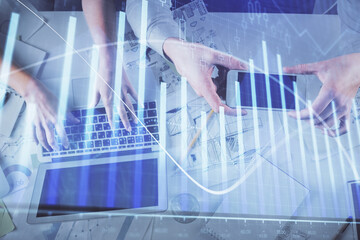 Multi exposure of man and woman working together and forex graph hologram drawing. Financial analysis concept. Computer background. Top View.