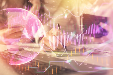 Double exposure of man and woman working together and financial graph hologram. Business concept. Computer background.