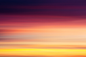 Colorful dramatic sunset shooted with horizontal camera motion. Abstract background