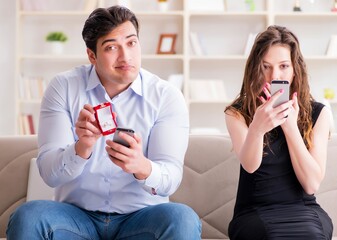 Young man making marriage proposal to girlfriend