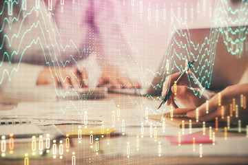 Multi exposure of woman hands typing on computer and forex chart hologram drawing. Stock market analysis concept.