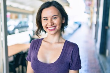 Young beautiful girl smiling happy walking at street of city