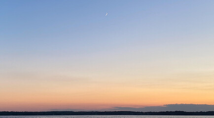 Fototapeta premium on the boat sunset on the lake