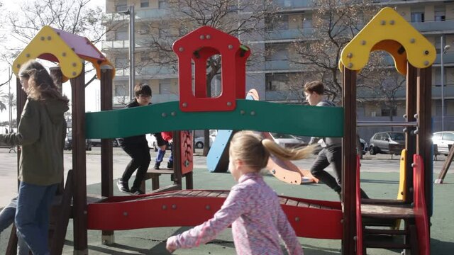 Children of different ages play on the playground