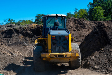 Obraz premium tractor loads mulching ecology
