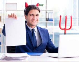 Devil angry businessman in the office