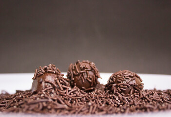 Chocolate granulated is poured. Homemade brazilian sweets. Brigadeiro, Portuguese for 