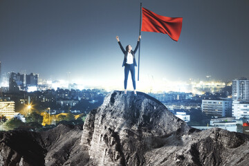 Happy businesswoman with red flag