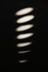 Sunlight coming through a window on a white wall