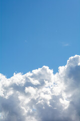Blue sky background and fluffy white cloud in sunny day