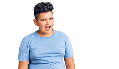 Obraz premium Little boy kid wearing sports workout clothes winking looking at the camera with sexy expression, cheerful and happy face.