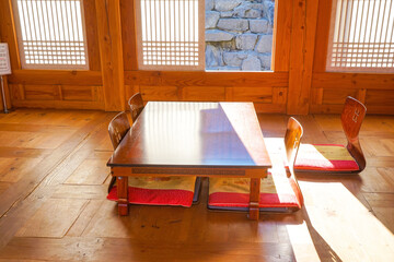 Interior with sliding doors, a small table.Traditional korean architecture.