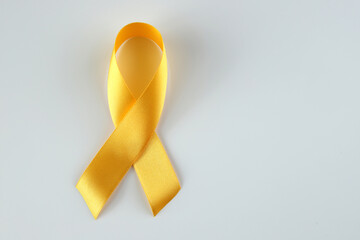World Suicide Prevention Day with yellow ribbon on a white background. September yellow ribbon