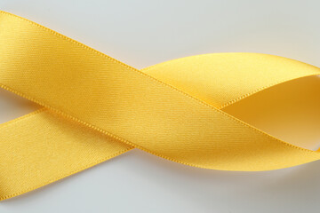World Suicide Prevention Day with yellow ribbon on a white background. September yellow ribbon