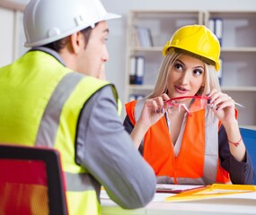 Construction workers having discussion in office before starting